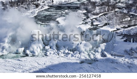 Detail of Niagara\'s Bridal Veil Falls covered in the ice and snow of a frigid Great Lakes Winter. The image was shot from Niagara Falls, Ontario, Canada.