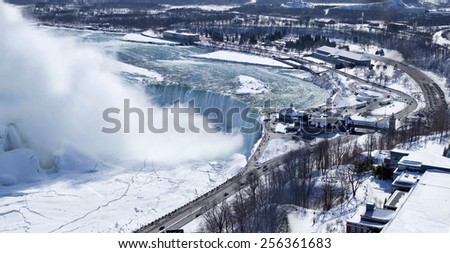 Aerial view of Niagara Falls' Horseshoe Falls. Image shows the curve of the falls as well as some of the land around this well known natural Wonder of the World.