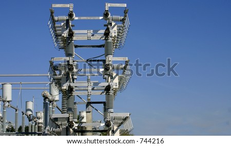 Power distribution equipment in an electrical sub-station somewhere in Central Florida. Framed against blue sky with empty space for text. PowerStation00077a
