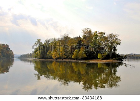 island reflection in the mirror like waters of the Tennessee River (Hiwassee River, Chickamauga Lake)