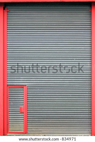 A warehouse shutter with small access door