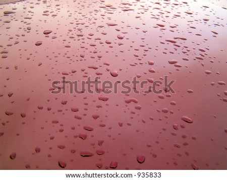 Raindrops on the hood of a truck