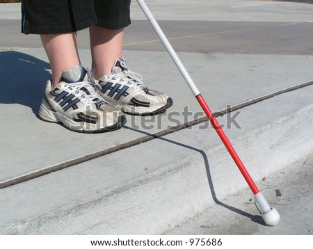 Blind woman traveling with white cane