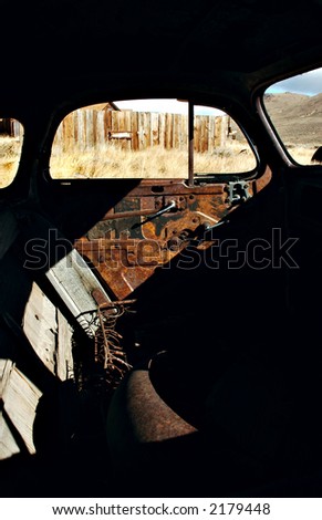 The interior of an old abandoned car in the ghost town of Bodie, California