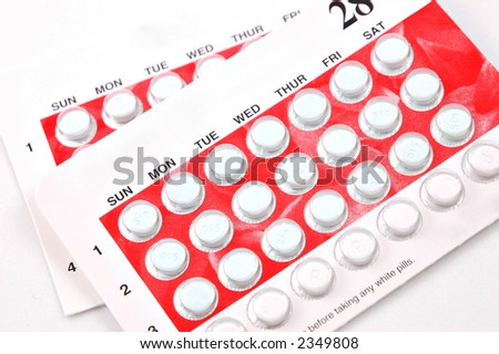 Two packages of birth control pills isolated on white