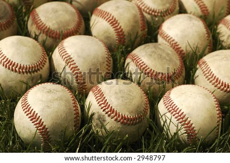 Nostalgic baseballs in the grass on a baseball field