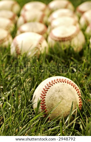 Nostalgic baseballs in the grass on a baseball field