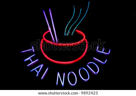 Neon sign advertising Thai noodle bowls at a restaurant