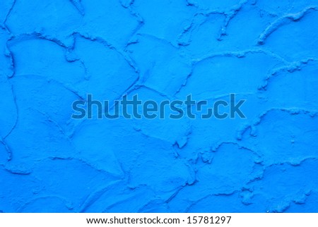Bright blue painted stucco wall for background