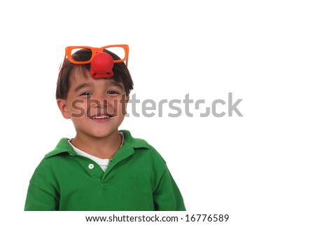 Five year old boy wearing a clown nose and glasses