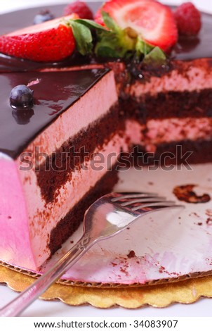 Fresh raspberry cream chocolate cake on paper plate