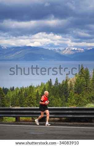 77-year-old man running uphill in a race, Daggett Pass, Lake Tahoe, Nevada