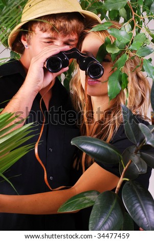 http://image.shutterstock.com/display_pic_with_logo/52593/52593,1248957028,2/stock-photo-teenage-couple-wearing-safari-hat-with-binoculars-adventuring-in-the-jungle-34477459.jpg