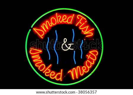 Smoked meats and fish neon sign isolated on black