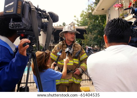 SACRAMENTO, CA - AUGUST 28: Sacramento Metro Fire District Assistant Chief Brian Rice talks to reporter about apartment destroyed by fire that also injured a child August 28, 2010 in Sacramento, California.
