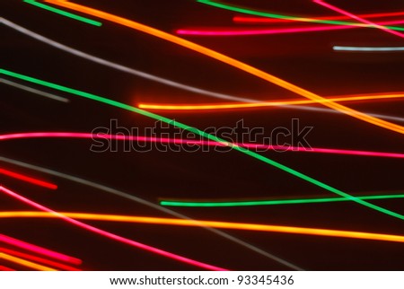 Streaks of colorful lights in motion