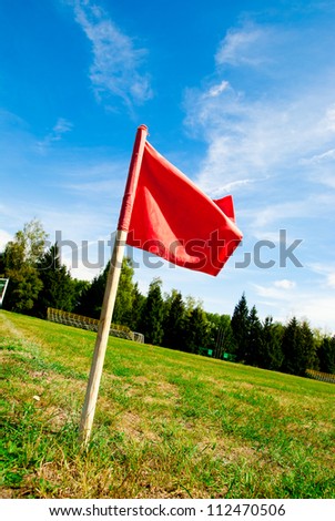red flag on a green football field
