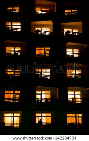 illuminated windows of a house at night