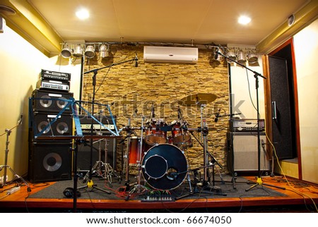 music studio with drums and amplifiers