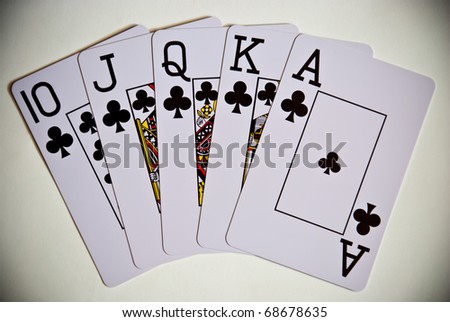 five playing cards showing royal flush