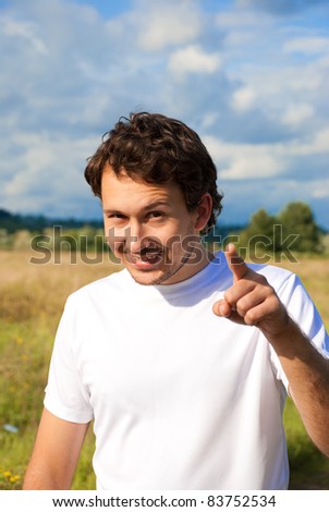 man in the meadow pointing the finger at you