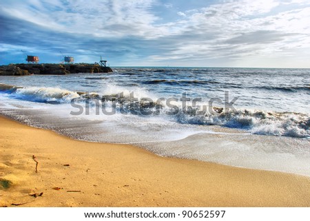 a majestic seascape with water, sky and sand