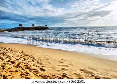 a majestic seascape with water, sky and sand