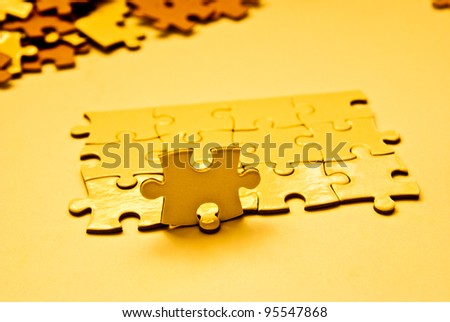 heap of golden puzzle pieces