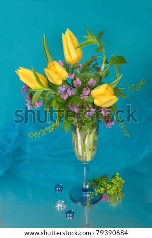 Yellow tulips and violets