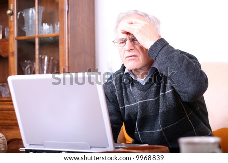 Senior man with a computer problem