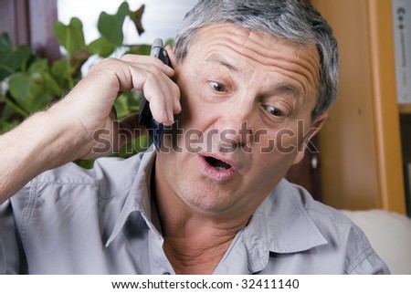 Portrait of a senior man speaking on the cellular phone