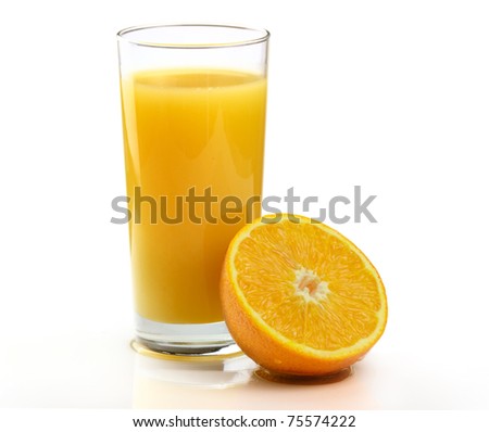 A Glass of freshly squeezed Orange juice with Fruit on a white background.