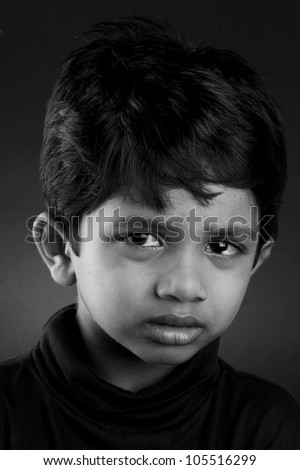 Black and white image of a crying kid