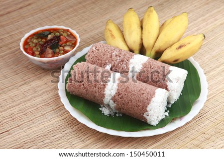 Indian Breakfast Puttu With Curry And A Bunch Of Banana.