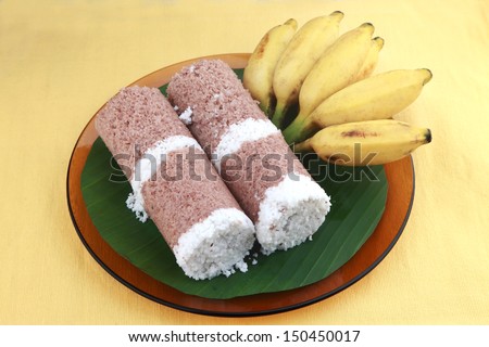 Indian breakfast Puttu with a bunch of banana.