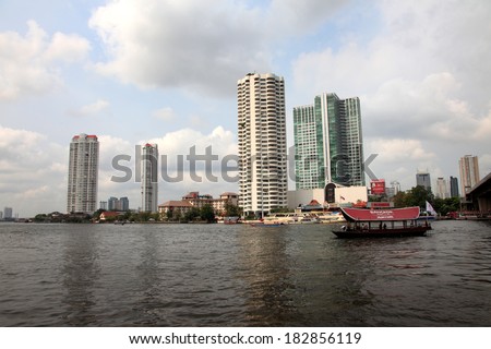 BANGKOK, THAILAND - FEB 12 : Cruise boats transport tourists through the river Chao  Phraya in Bangkok on February 12, 2011. It is the principal river that flows through 365 km of land in Thailand.