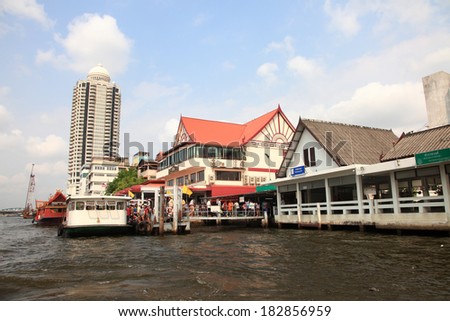 BANGKOK, THAILAND - FEB 12 : Cruise boats transport people through the river Chao  Phraya in Bangkok on February 12, 2011. It is the principal river that flows through 365 km of land in Thailand.