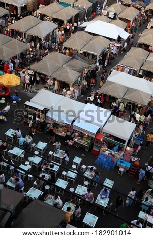 BANGKOK, THAILAND - FEB 12 : People spend time in the Onnut square flea market in Bangkok on February 12, 2011. Flea market and street food popular among both natives and tourists in Bangkok.