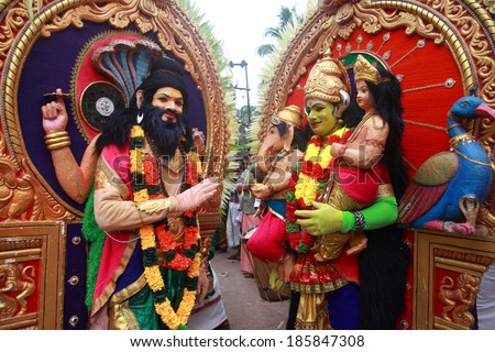 KIDANGANNUR, INDIA - APR 02 :Unidentified men dressed as a Hindu gods participate in the cultural procession during the Pallimukkathu temple festival on April 02, 2014 in Kidangannur, Kerala, India.
