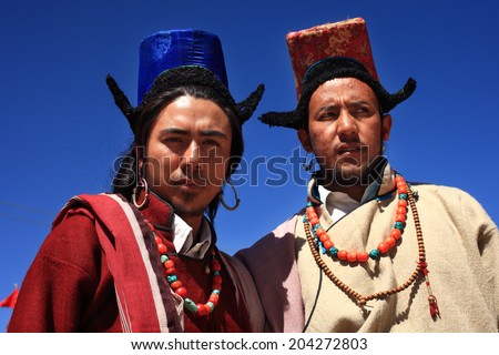 LEH, INDIA - SEPT 01 : Two unidentified Ladakhi tribal men wearing traditional costumes poses as they participate in a cultural procession during Ladakh Festival on September 01, 2012 in Leh, India.