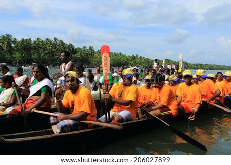 KALLADA, INDIA - SEPT 26: A snake boat team participate in the Kallada Boat race on September 26, 2012 in Kallada, Kerala, India. Boat races are the major sporting event in Kerala during Onam season.