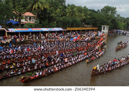 PAYIPPAD, INDIA - SEPT 18:Snake boat teams line up to participate in the Payippad Boat race on September 18, 2013 in Payippad, Kerala, India. Boat races are the major sporting events in Kerala.