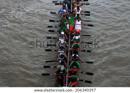 PAYIPPAD, INDIA - SEPT 18: A snake boat team participate in the Payippad Boat race on September 18, 2013 in Payippad, Kerala, India. Boat races are the major sporting events in Kerala.