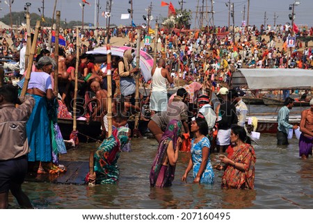 ALLAHABAD - FEB 08: Unidentified devotees take holy bath in the river during the Kumbh Mela on February 08, 2013 in Allahabad, India. Kumbh Mela is the largest religious human gathering in the world.