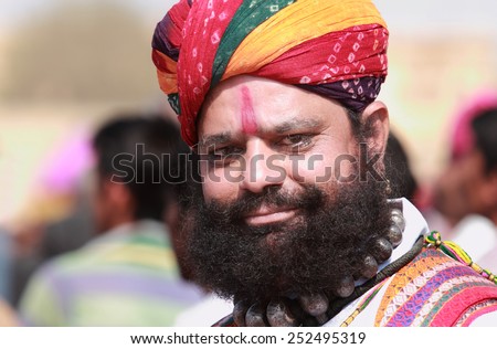 JAISALMER, INDIA - FEB 01: Unidentified traditionally dressed Rajasthani man with long mustache and beard participate in the Desert Festival held on February 01, 2015 in Jaisalmer, Rajasthan, India.