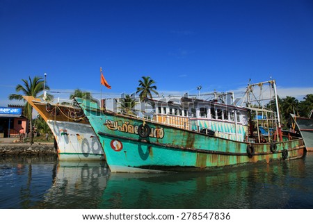 KOLLAM, INDIA - APR 17 : Fishing boats are docked in the Ashtamudi lake on April 17, 2015 in Kollam,Kerala, India. Astamudi is the second largest estuarine system in Kerala with large fish resources.