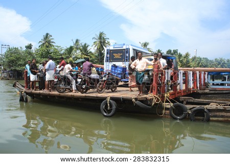 ALLEPPEY, INDIA -JUL 11 : People of the backwater region transport their vehicles in a big boat on July 11, 2010 in Alleppey, India. People of the region depend on boats for their transporting needs.