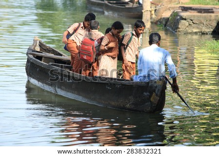 ALLEPPEY, INDIA -JUL 13 : Unidentified school children travel by boat in the backwaters on July 13, 2010 in Alleppey, India. People of the region depend on boats for their transporting needs