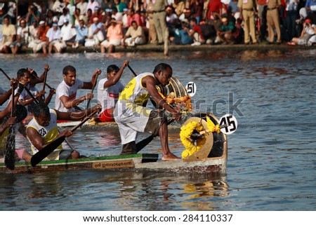 ALLEPPEY, INDIA - AUG 14 :Snake boat teams participate in the Nehru Trophy Boat race on August 14, 2010 in Alleppey, India.Nehru Trophy Boat race is very popular and competitive race event of Kerala.