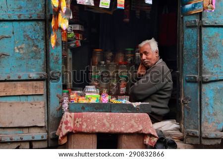 AJMER, INDIA - FEB 04: An unidentified retail shop owner look for customers on February 04,2015 in Ajmer, Rajasthan, India.Small retail shops face big threat from the modern retailers chains in India.